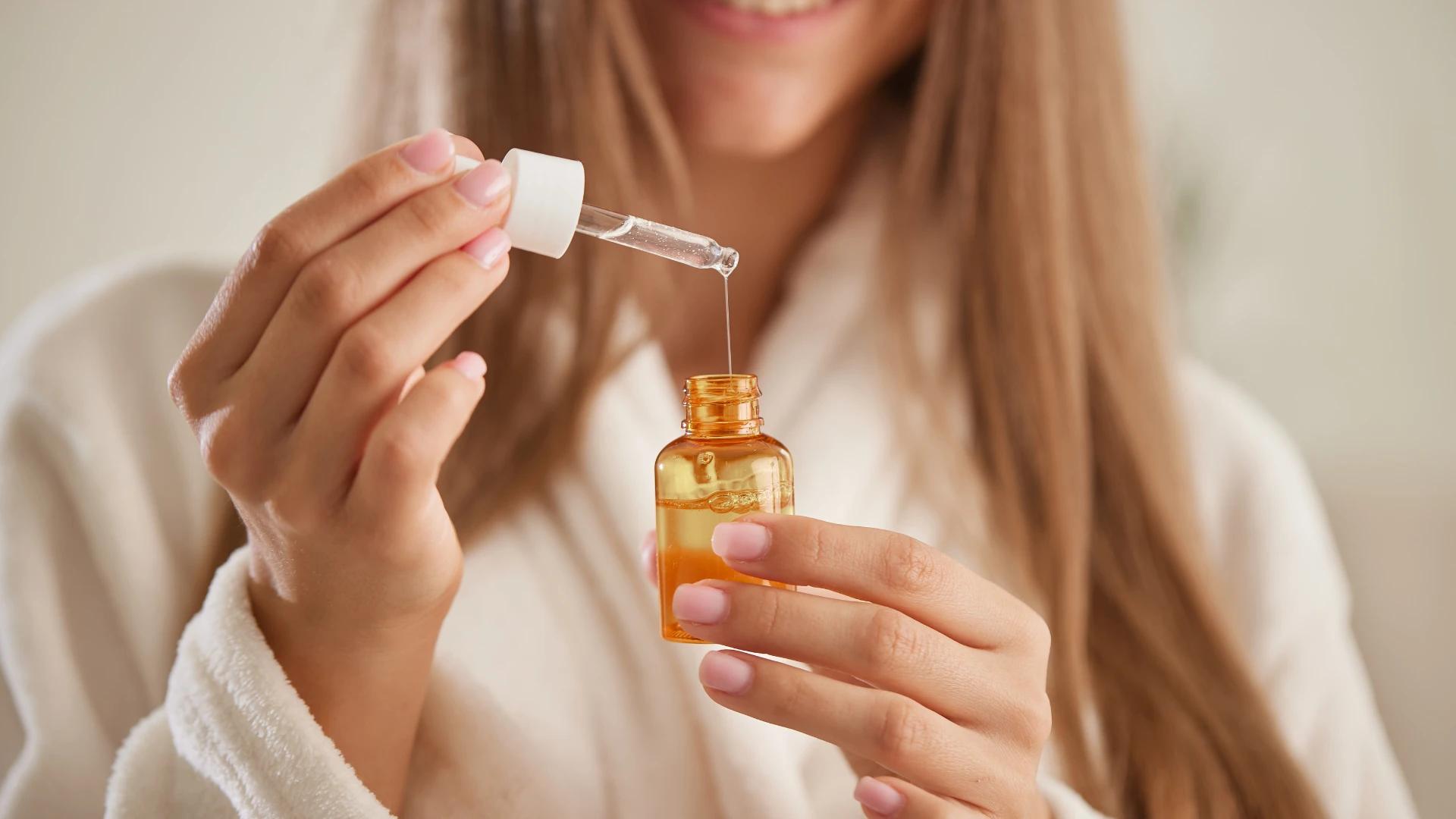 7 Best Serums for Frizzy Hair to Tame Flyaways & Smooth Strands